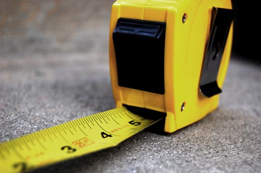 While not an overtly macho tool, the tape measure is the device behind the 