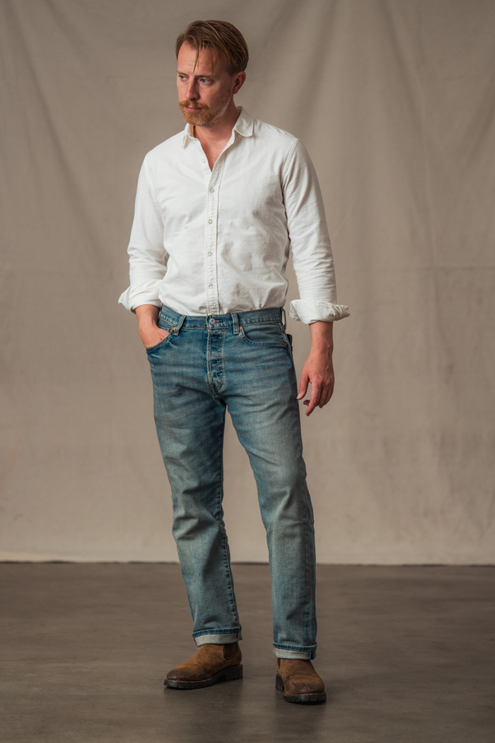 a man wearing levis original fit denim jeans