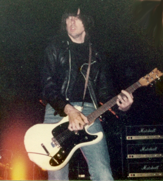 johnny ramone wearing light wash jeans in concert in 1983