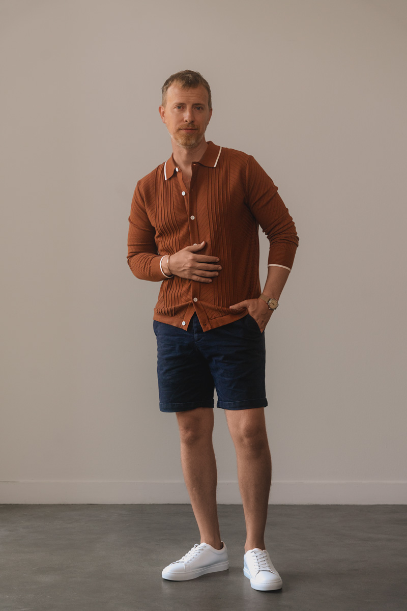 vintage knit polo with blue shorts and white sneakers - mens summer outfit inspiration